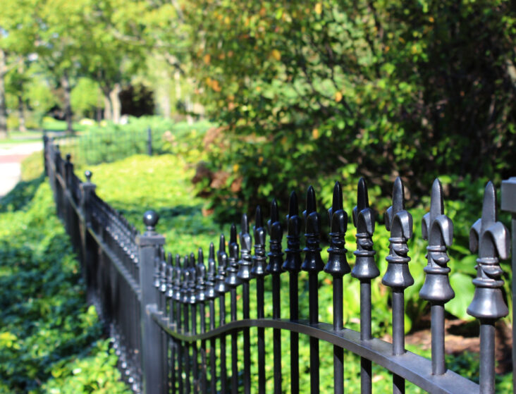 Aluminum vs Wrought Iron Fences for Your Yard Comparison Growing